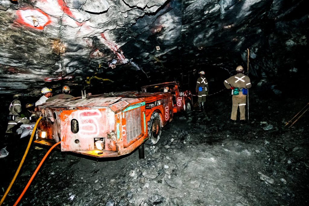 Underground mining loader operating in narrow tunnel with collision prevention and proximity detection technology