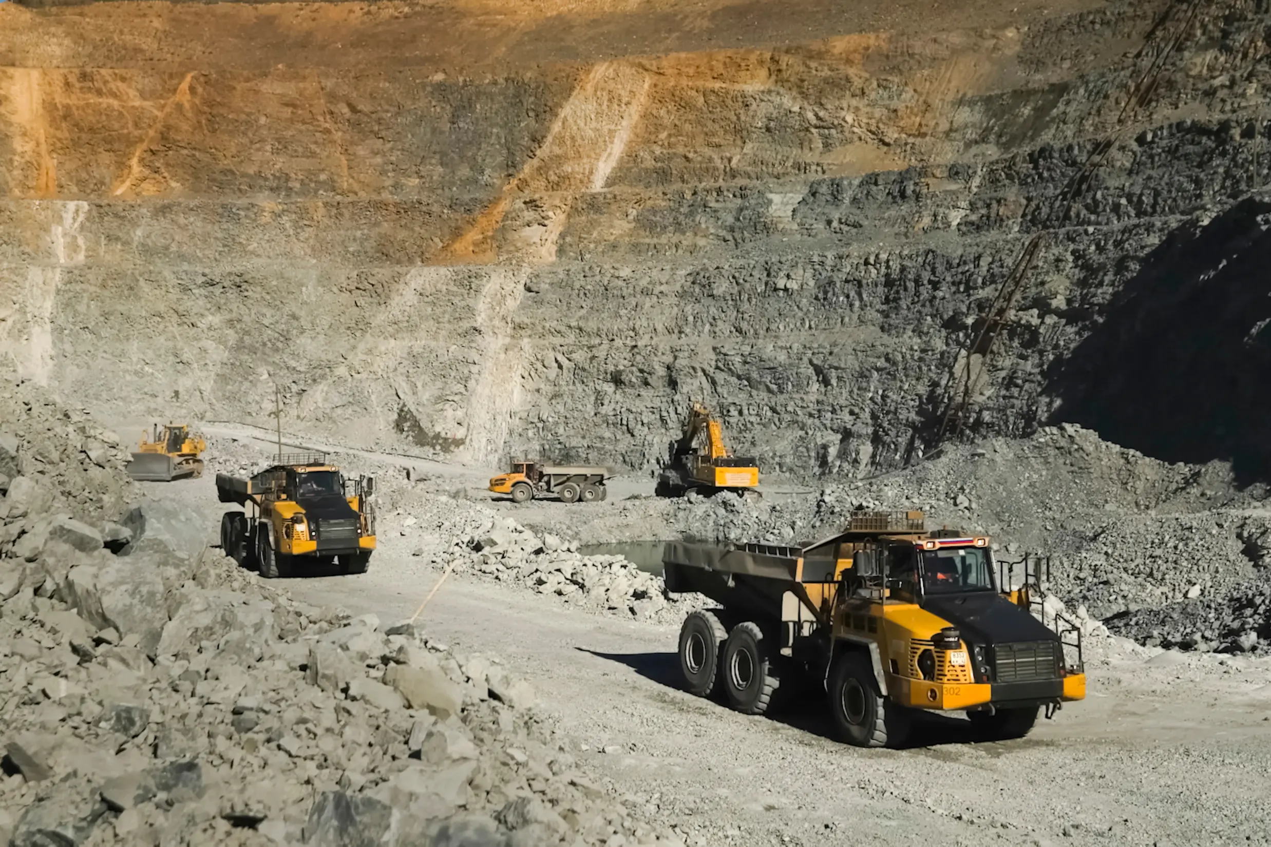 Level 9 collision prevention system installed on mining haul truck at open pit mine — automated braking intervention protecting primary fleet
